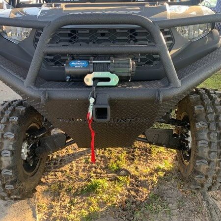 Polaris Ranger 1000 UTV with heavy-duty front bumper for off-road protection and rugged terrain use