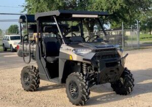 Polaris Ranger Crew UTV equipped with an aluminum roof designed for cab protection from weather